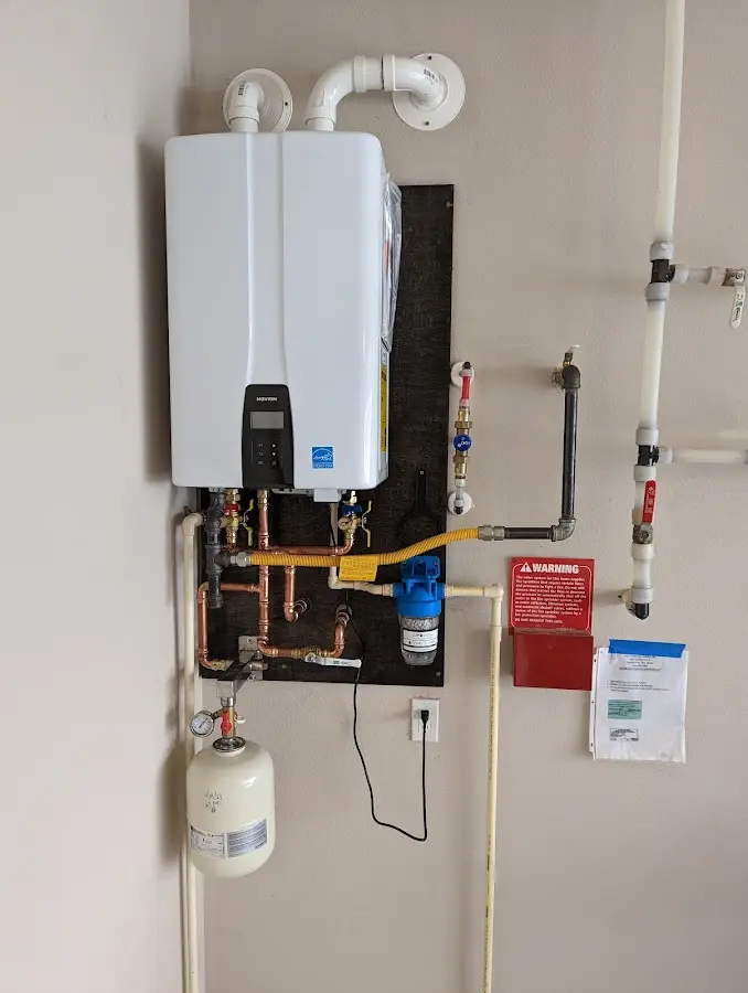 Professional plumber installing copper piping in a Stanwood home